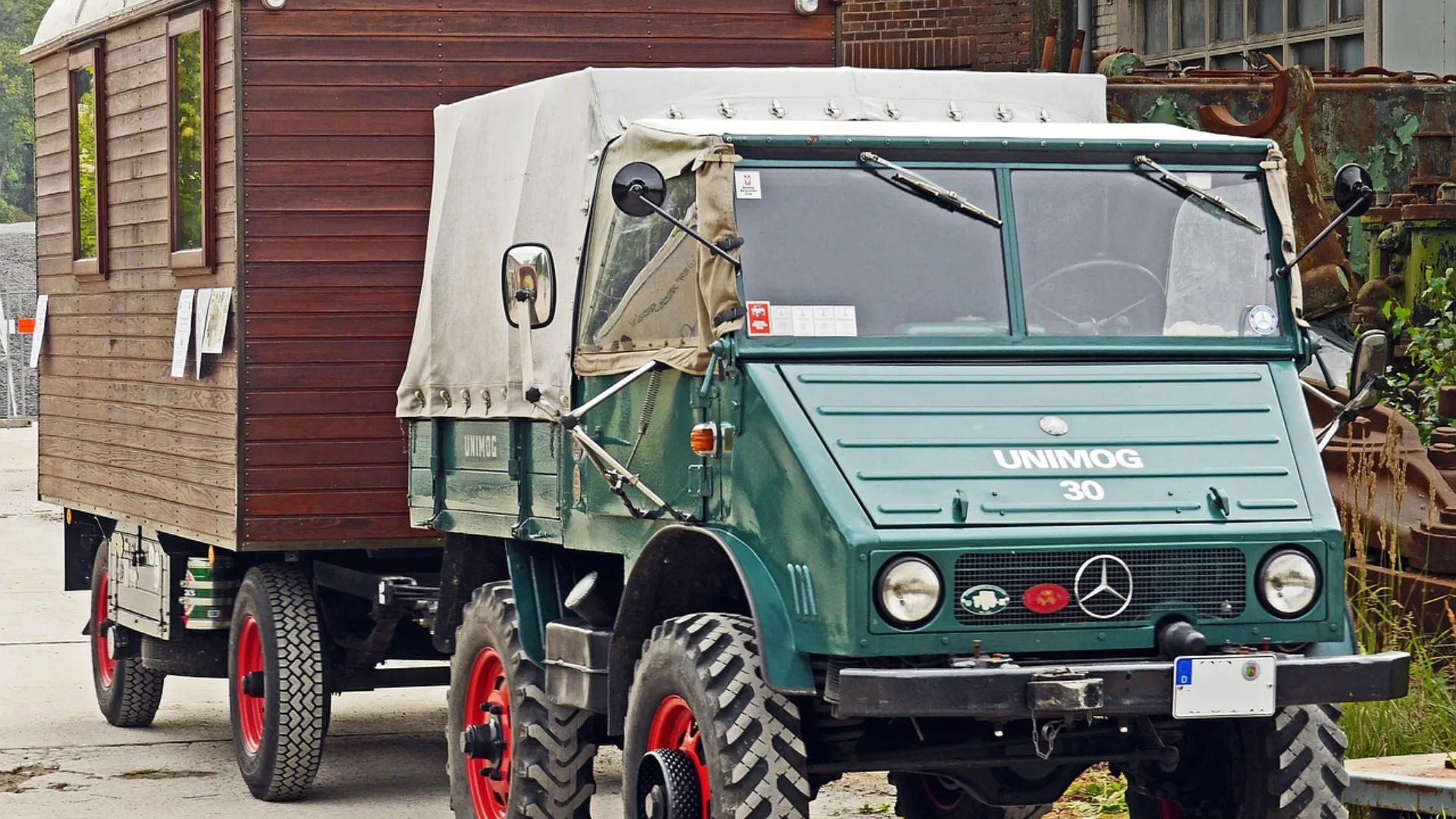 old-generation-green-mercedes-benz-unimog-pulling